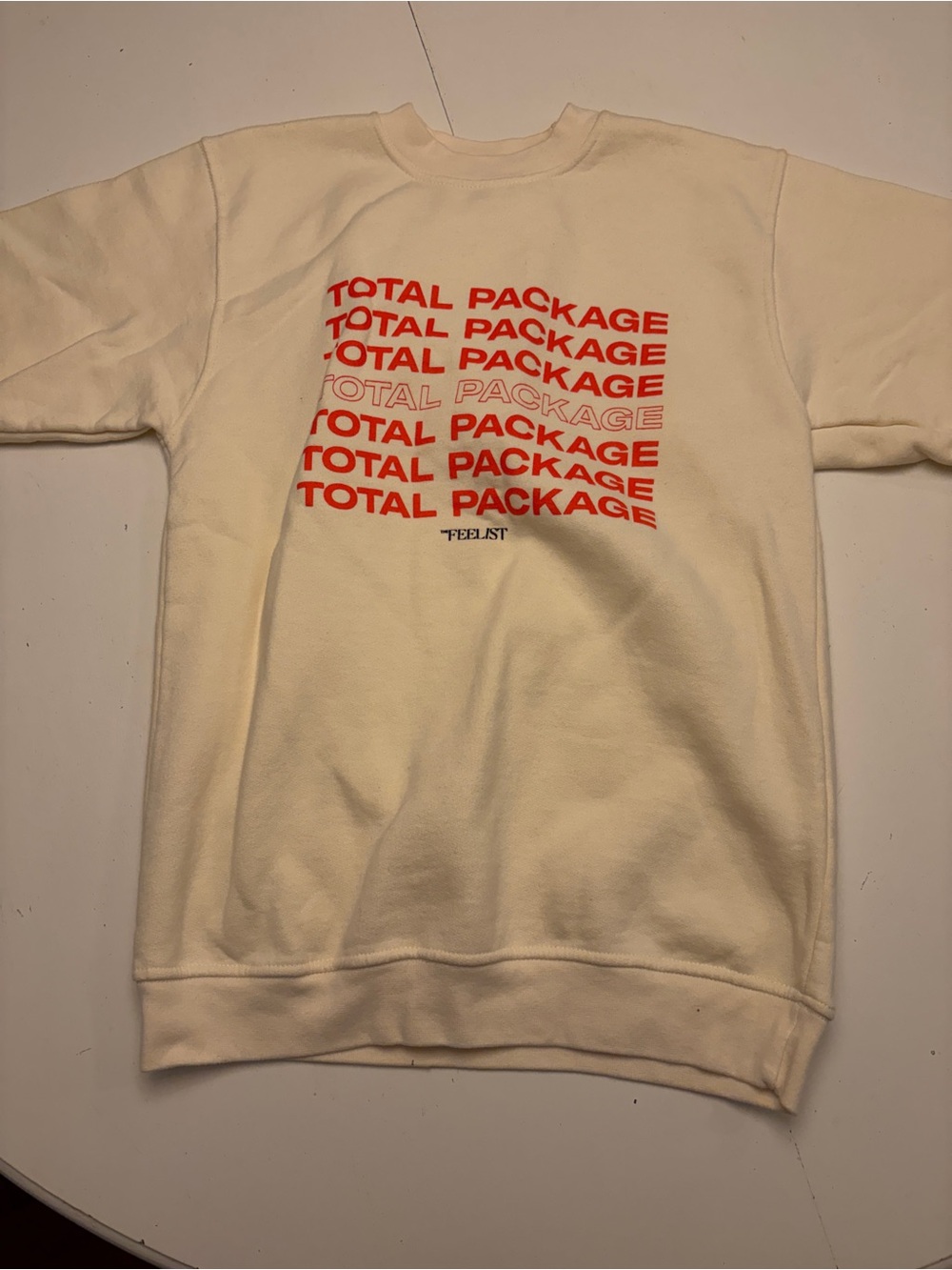 Cream Crewneck Sweatshirt with Red 'Total Package' Graphic